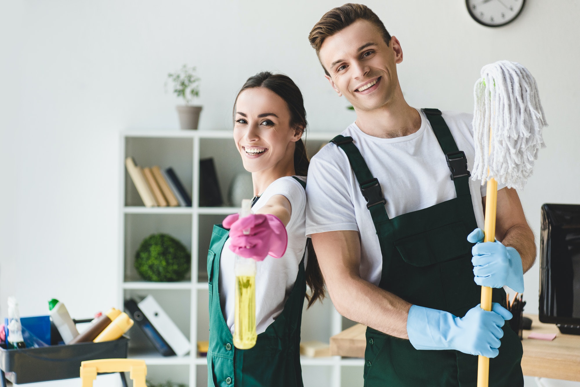 Commercial cleaning team with cleaning equipment in an office